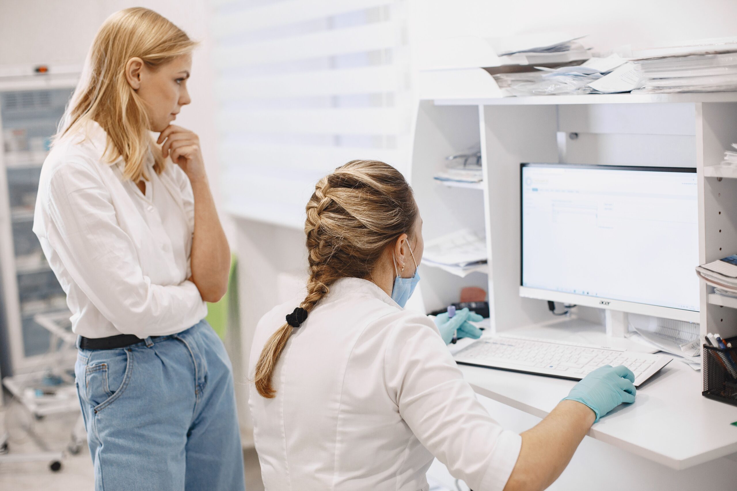 Healthcare professionals reviewing medical information in a clinical setting